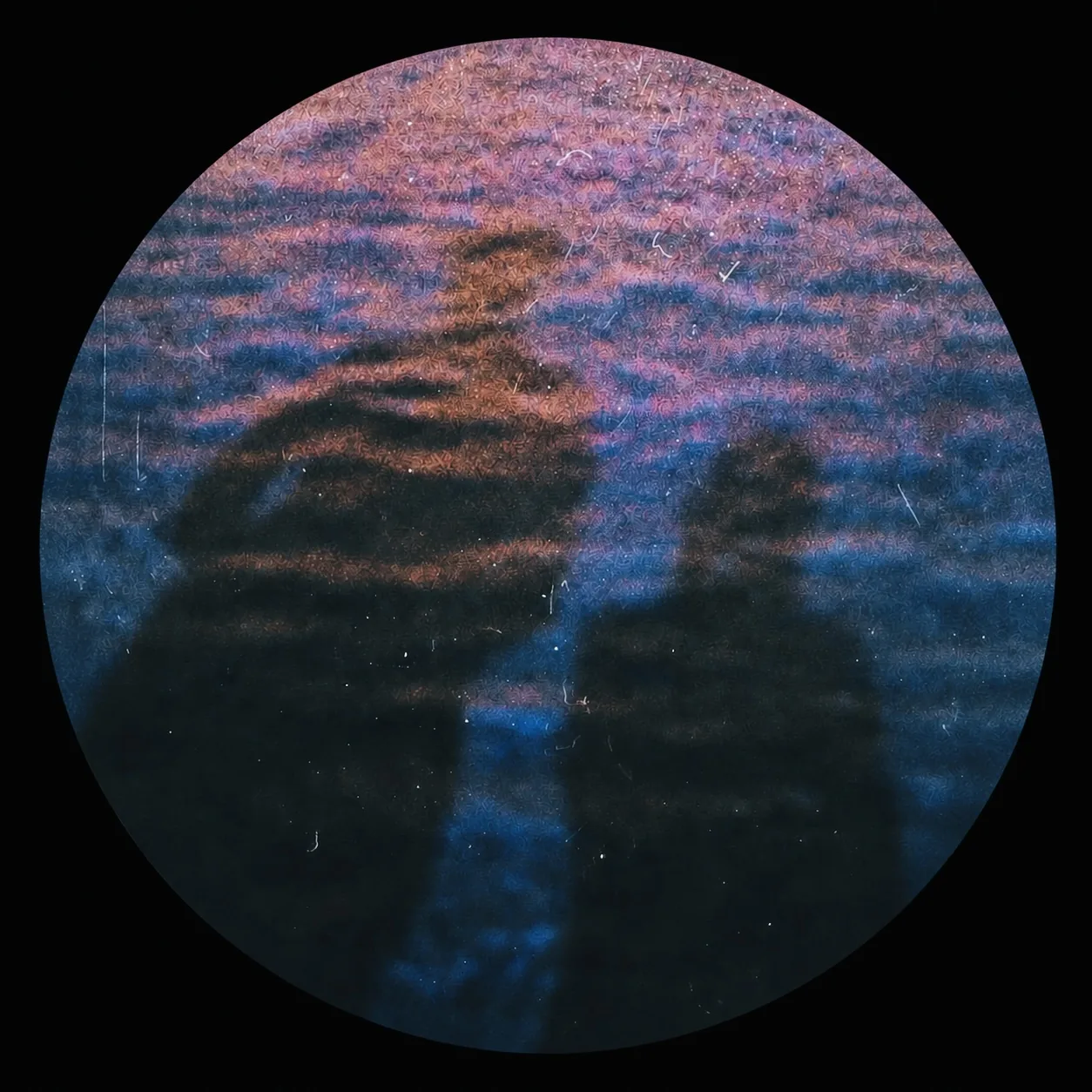 Circular photo of two silhouettes on rippled water at dusk — Bridget In My Room
