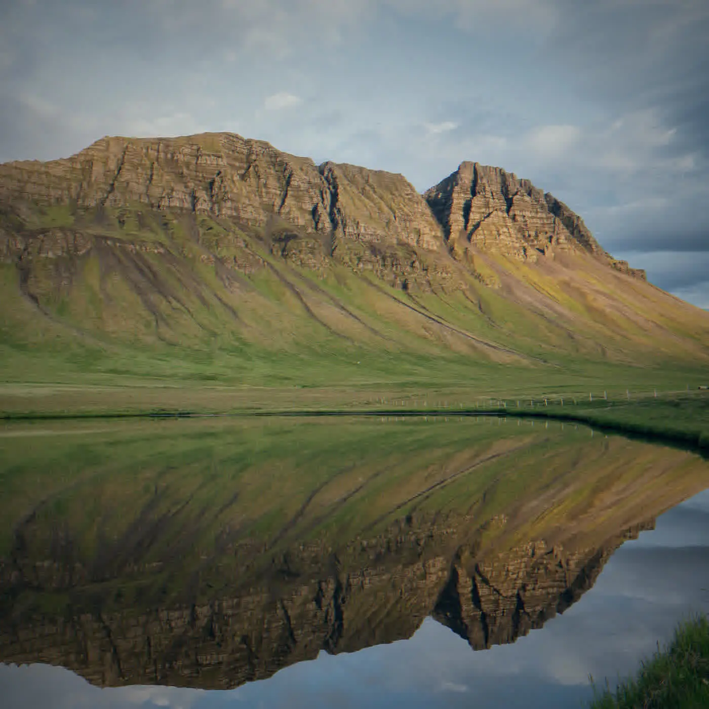 Mountains reflected in a pond, Iceland. Photo: Eric Kilby, CC BY-SA 2.0.