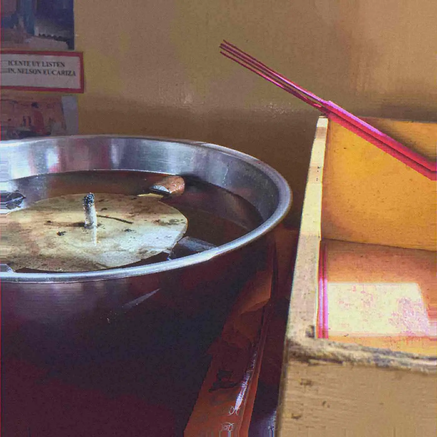 Incense sticks in a temple bucket. Photo: Angelo Marcellano, CC BY-SA 4.0.