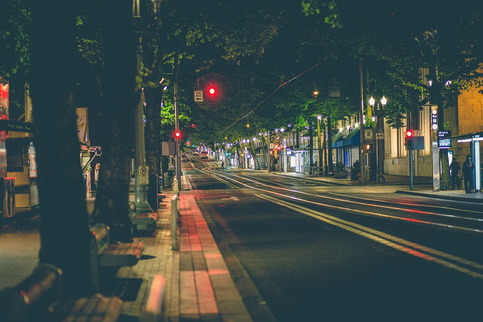 Downtown Portland, Oregon at night, street lights and mid-rise blocks.