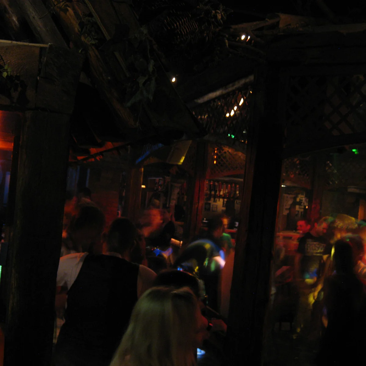 Empty disco floor, mirrored ball overhead, speakers in the dark, no people. Photo: Yerutskow, CC BY-SA 3.0.