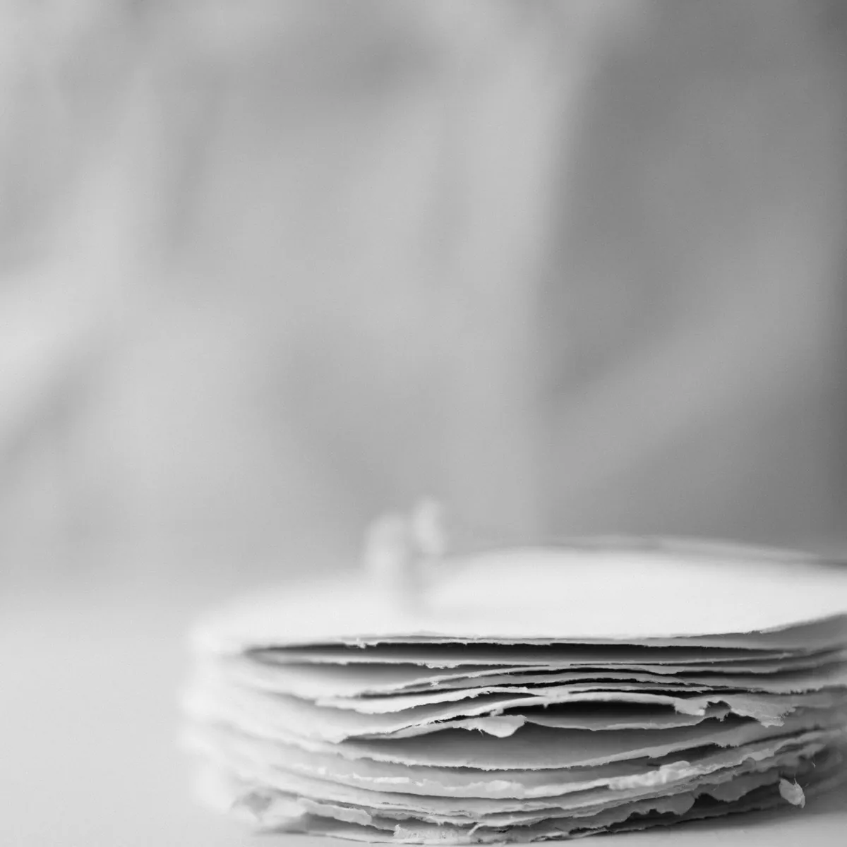 Stack of blank paper pages, no titles, no people. Photo: Kasia Sikorska, Pexels License.